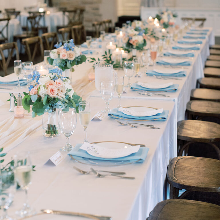 Kate & Tommy Banquet Space near Milwaukee at The Covenant with stained glass windows and tables arranged for guests.